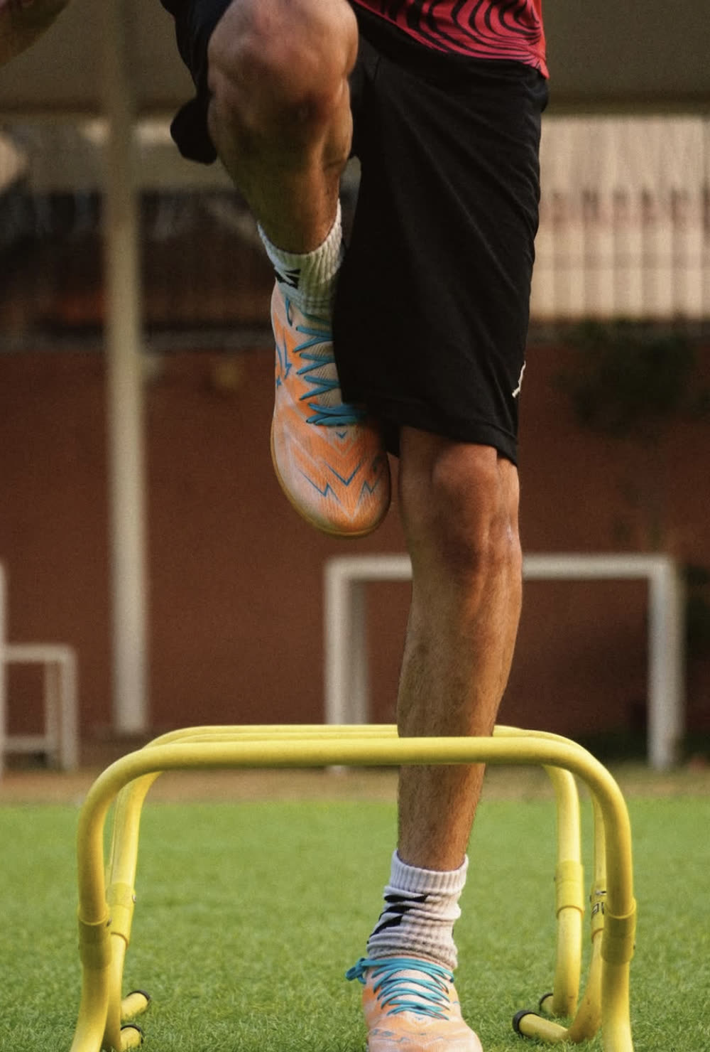 Sikki running hurdle drills in LYNX PL15 turf boots
