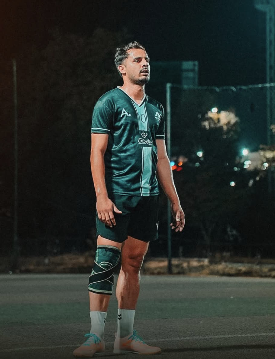 Umer Saeed on a floodlit pitch in LYNX PL15 turf boots