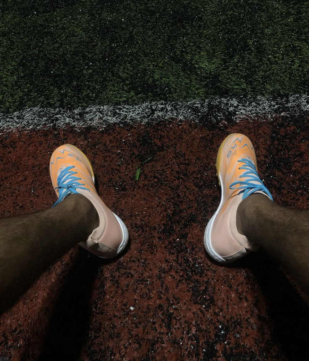Caleb on the touchline in LYNX PL15 turf boots